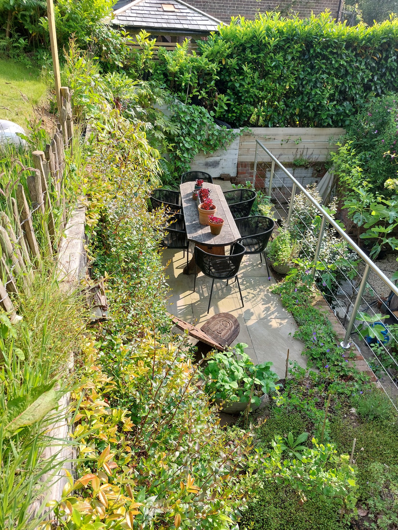 Steel RSJ sleeper retaining wall creating a new garden terrace in Haslemere